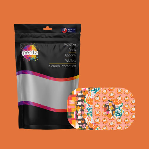  A black packaging bag labeled "Peelz" with a colorful logo and text listing product categories such as patches, apparel, wallets, and screen protection. The bag displays a "Made in USA" label at the top. Next to the bag is a set of vibrant adhesive patches featuring Thanksgiving-themed designs, including pumpkins, autumn leaves, and plaid patterns. The background is a solid orange color.