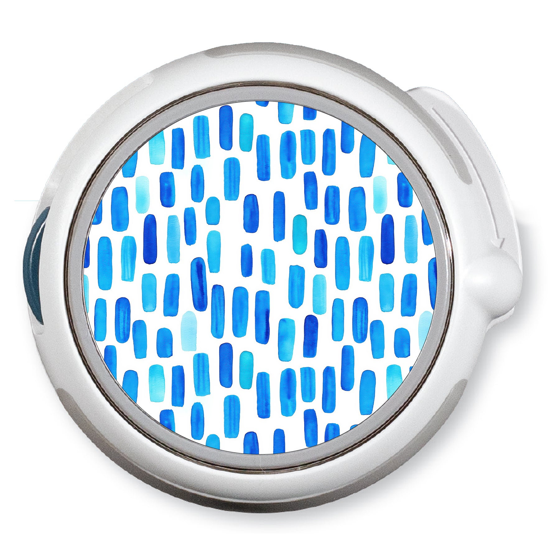 Round metallic object with blue pattern on a white background